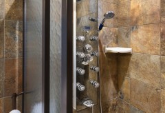 Standing shower with a shower panel