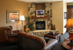 Living Area with sofa, chairs, end tables, and a fireplace